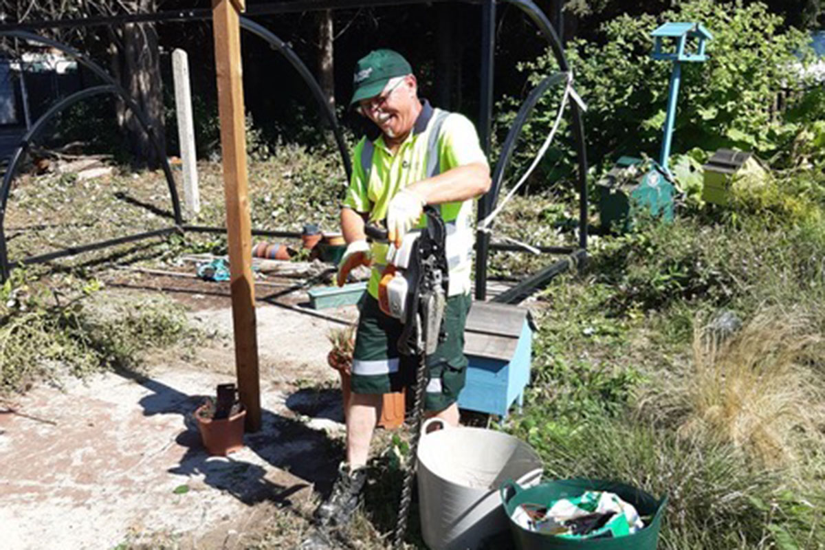 Greener Ealing Grounds Maintenance team member volunteering at Springhallow.